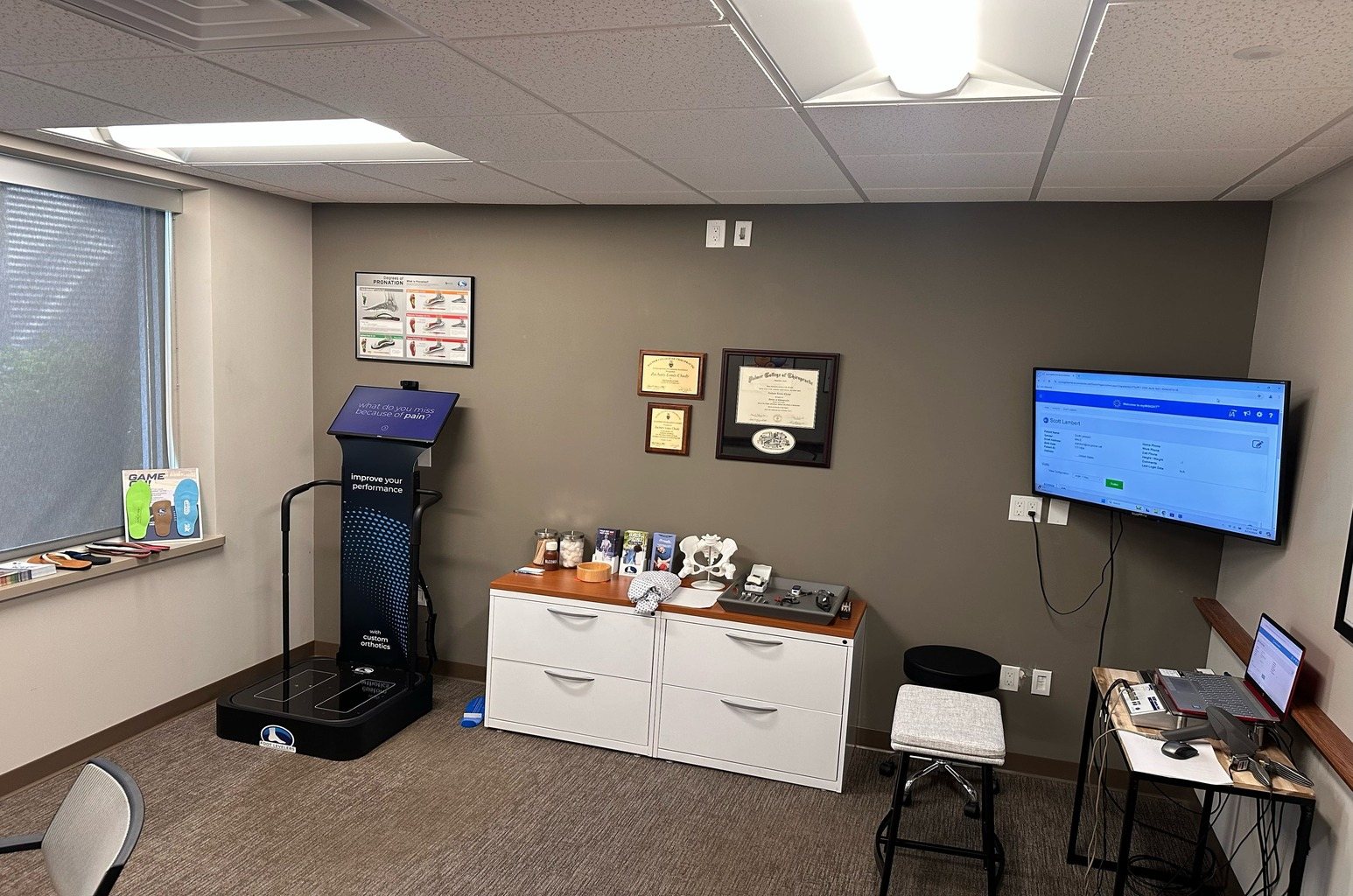Exam room at Flex Care Chiropractic, with Dr. Chudy's Palmer College diploma on the wall